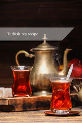 Glass cup of hot Turkish tea on wooden table