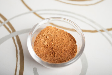 Ground cinnamon baking seasoning in a small bowl