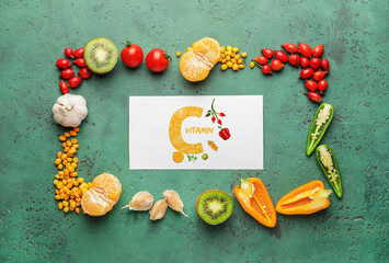 Healthy products rich in vitamin C on color background