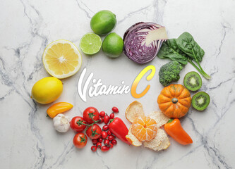 Healthy products rich in vitamin C on white background