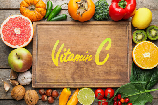 Healthy products rich in vitamin C on wooden background