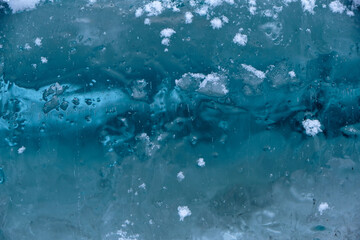 the texture of ice with snow in winter on the street