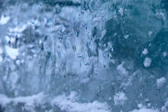 the texture of ice with snow in winter on the street © madnessbrains