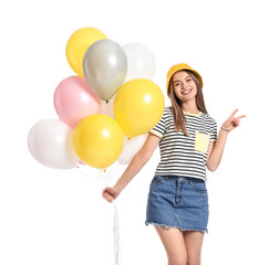 Beautiful young woman with balloons showing victory gesture on white background