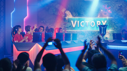 Two Esport Teams of Pro Gamers Play in RPG Strategy Video Game on a Championship Arena, Happy Red...