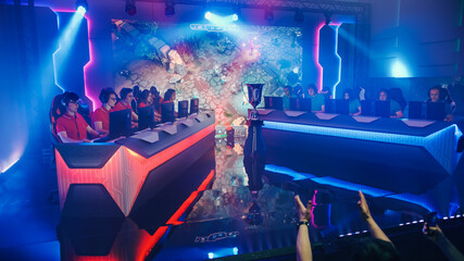 Two Esport Teams of Pro Video Game Players Playing in a Championship Arena. Cyber Games Online...