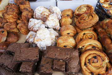 Many kind of delicious bakery, brownies, pastry, croissant with almond selling in farmer market
