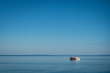 Fototapeta na wymiar Lonely boat in the sea outside Sweden