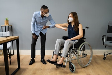 Obraz na płótnie Canvas Disabled People In Wheelchair Elbow Bump