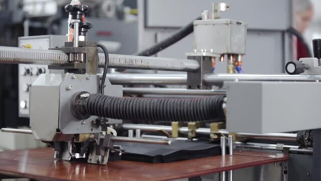 Modern automatic conveyor line for the production of package. Modern factory of production cardboard box. Manufacture of cardboard boxes from paper. Enterprise for production package