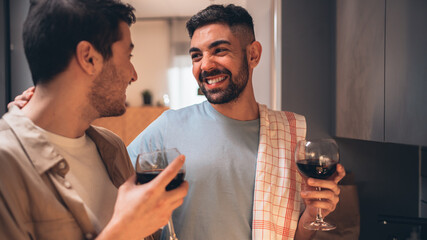 Happy Gay Couple in Love Drink Wine, Chat, Prepare Delicious Dinner Meal. Two Boyfriends Have Lovely Romantic Evening. Partners Talk, Share Beautiful Moments. Close-up Portrait