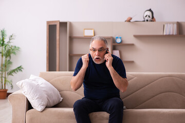 Devil visting old dying man at home