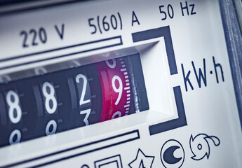 Payment of utility services, concept. Part of an electricity meter, close-up. Selective focus,...