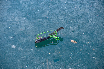 kids toy snowracer left on lakes ice