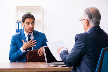 Young male candidate employee meeting with old recruiter