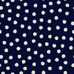 Seamless polka-dot pattern on dark blue background for surface design and other design projects