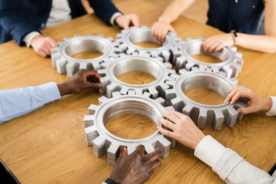 Businesspeople Hands Joining Gears. Support