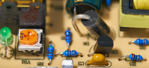 the board with radio components is on the table