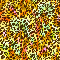 Seamless pattern made of leopard spots skin texture with blurred summer background. African animal fur tracery. Spotted ornament. Vintage style. Good for wrapping, banner, fashion, textile and fabric.