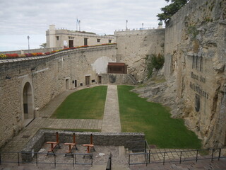 San Marino, Cava dei balestrieri. Panorama of the quarry carved into the rock and with a green lawn...