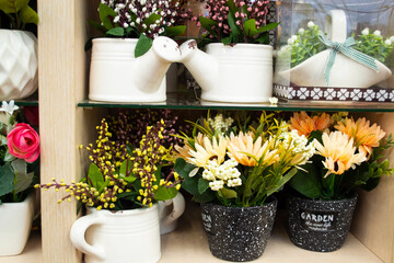 Artificial flower composition in floral shop. Objects of interiors, making bouquets.