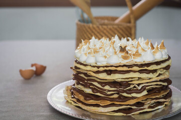 kitchen utensils with chocolate cake