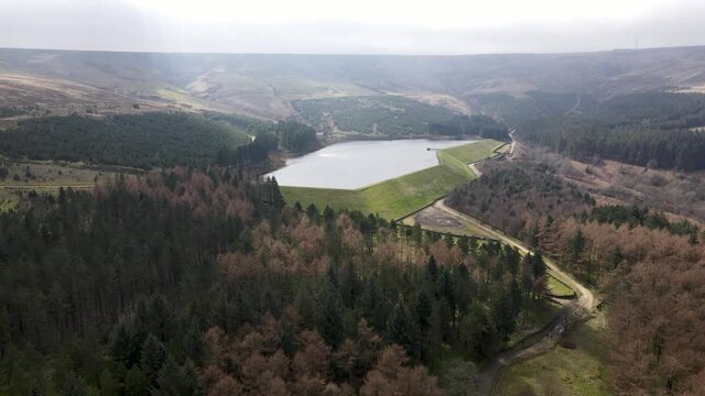 Aerial Drone View Stunning Reservoir of Water In Peak District West Yorkshire Holmfirth Yateholme With Forest Hike Walking trail