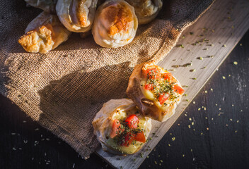Black table with ingredients and artisan hot food