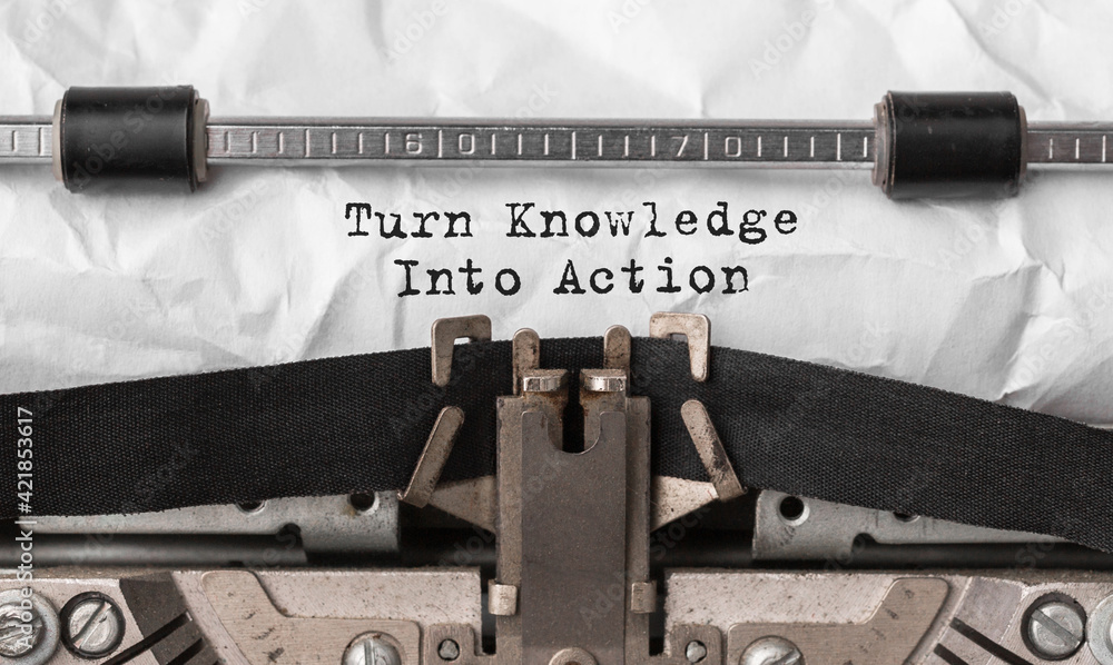 Poster text turn knowledge into action typed on retro typewriter