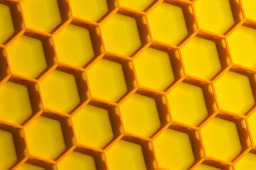 Hexagonal cells grid on a yellow background. Abstract geometric texture. Honeycomb concept
