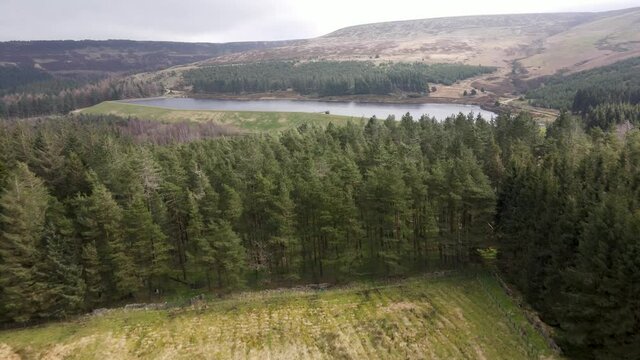 Aerial Drone View Stunning Reservoir of Water In Peak District West Yorkshire Holmfirth Yateholme With Forest Hike Walking trail