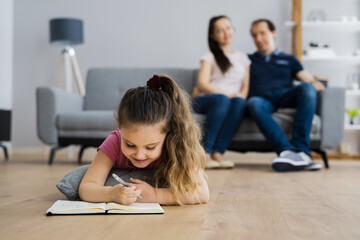 Happy Couple With Kid On Floor