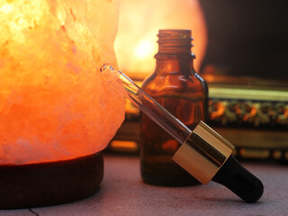 Aromatherapy. Pipette and aroma oils, salt lamp.