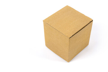 A small box of corrugated cardboard on a white background for packing, transporting various things, mockup for design and advertising. Copy space