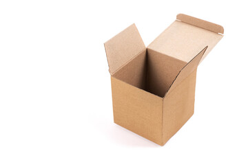 A small open empty box of corrugated cardboard on a light background for packing, transporting various things, mockup for design and advertising