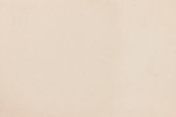 The light texture of old, yellowed paper, covered with traces of ink stains.