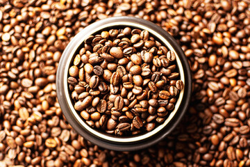 Coffee beans. Coffee beans are spread out on the surface.