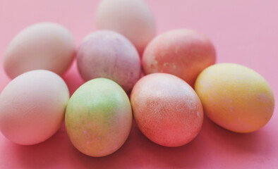 Easter eggs in trendy pastel colors on a pink background, Easter Catholic and Christian