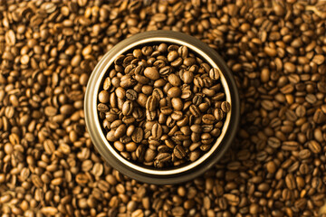 Coffee beans. Coffee beans are spread out on the surface.