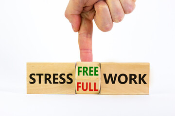 Stress free work symbol. Doctor turns a cube and changes words 'stress full work' to 'stress free work'. Beautiful white background. Psychological, business and stress free work concept. Copy space.