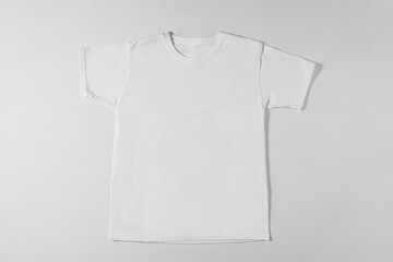 White t-shirt on grey background