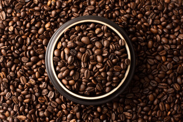 Fototapeta premium Coffee beans. Coffee beans are spread out on the surface.