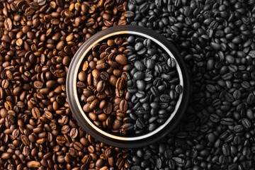 Coffee beans. Coffee beans are spread out on the surface.