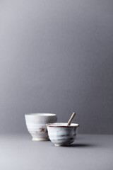Traditional, handcrafted ceramic on gray background. Soft focus. Copy space.	