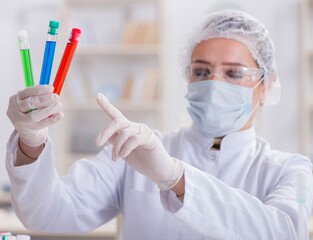 Woman chemist working in hospital clinic lab