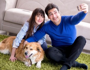 Happy family with golden retriever dog