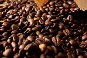Coffee beans. Coffee beans are spread out on the surface.