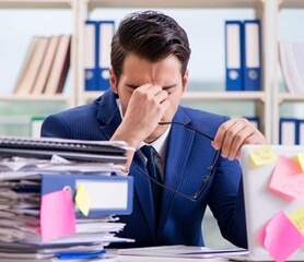 Businessman with reminder notes in multitasking concept