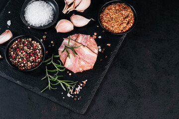 Raw chicken burger with rosemary branch and spices. Instant meat. Grilled hamburgers.Copy space