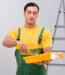 Man painting the wall in DIY concept